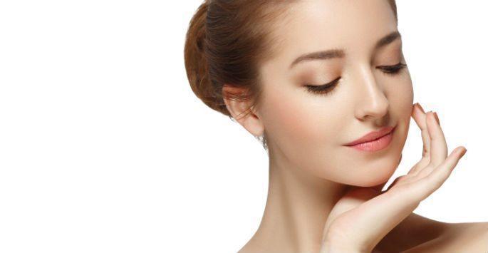woman touching her face