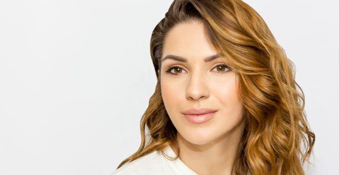 woman smiling against white background