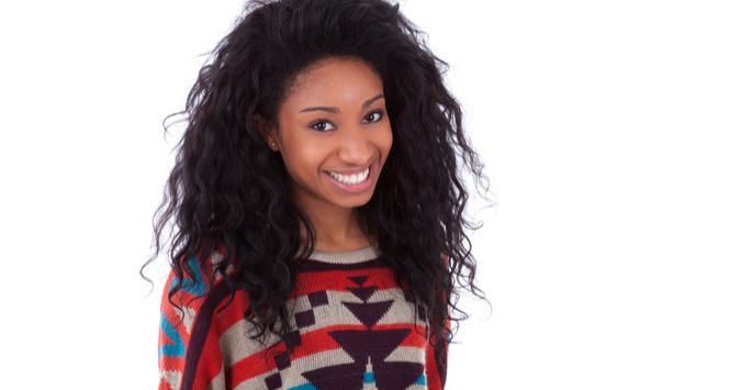 woman smiling against white background