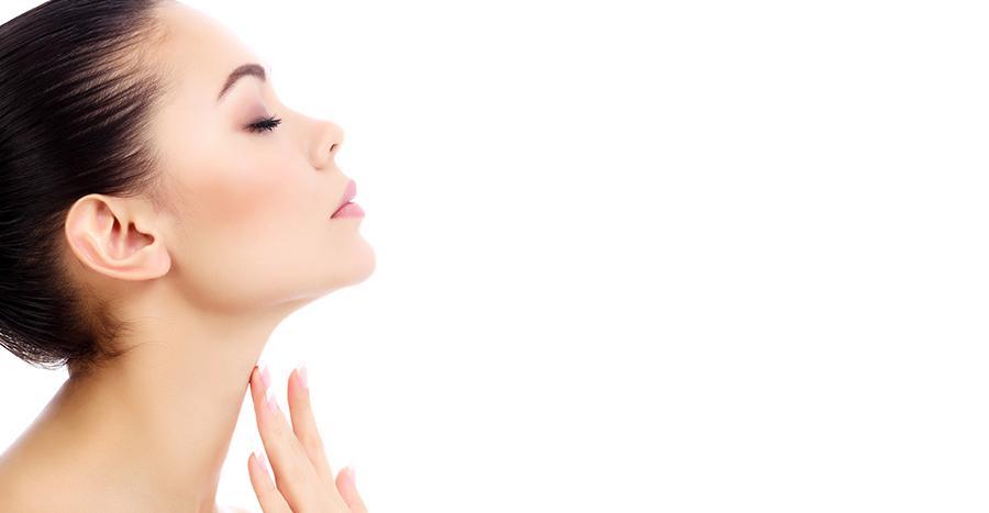 woman touching her neck