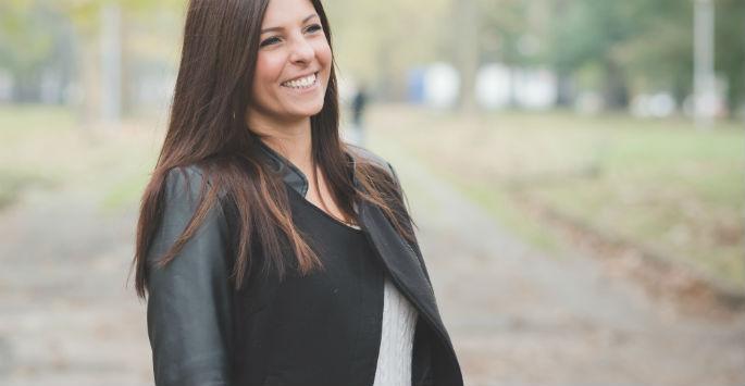 woman laughing in a park