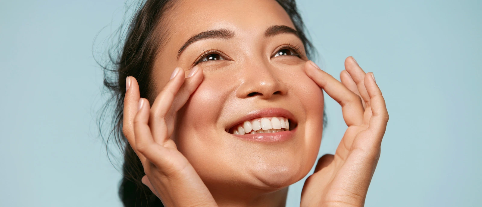 happy woman with glowing plump skin