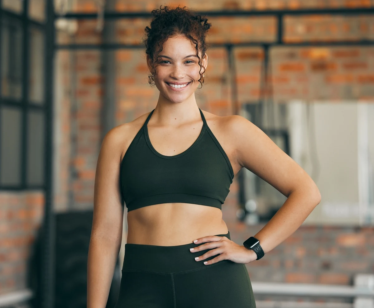 Fitness portrait, exercise and happy woman at gym for a workout